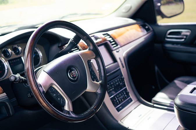 Black Cadillac Escalade/Suburban Round Trip Airport Transfer UVF - Snacks, drinks, and a smoother first hour