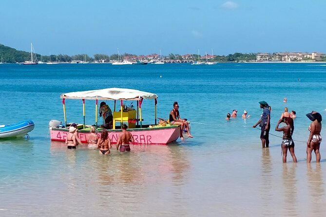 St. Lucia Beach Day with Paradise Beach Comforts & Transportation - What your four hours at Reduit Beach may look like