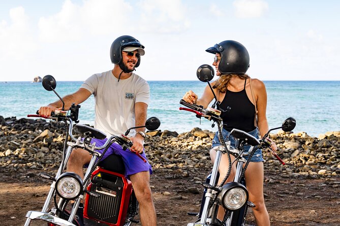 St.Lucia Beaches and Backroads Tour by Electric Big-Wheel Scooter - The Darren Sammy National Cricket Stadium adds local context